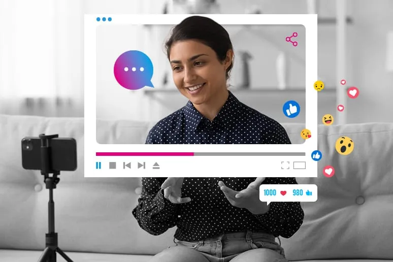 A woman is sitting on a couch with a video screen.