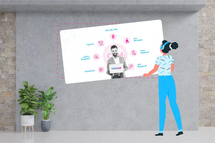 A woman is pointing to a wall with a picture of a person on it.